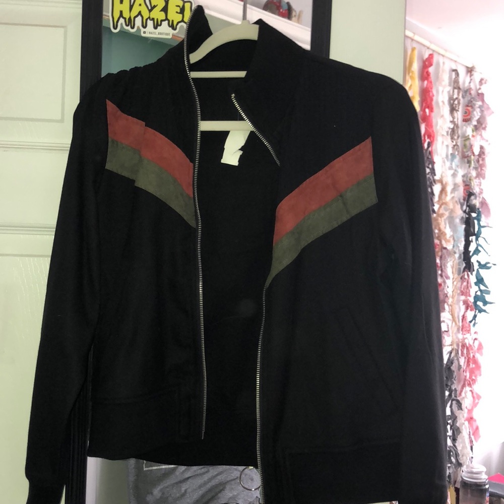 black jacket with green and red stripe